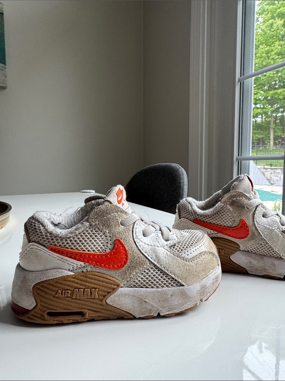 Nike Kids Sneakers in Beige with Orange Swoosh size 5